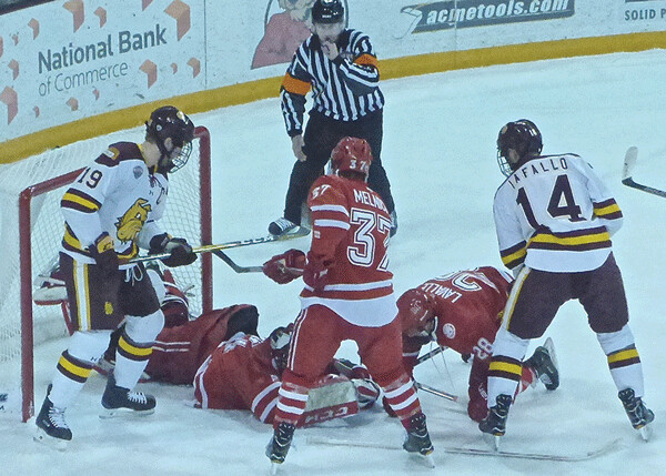 Down the stretch, as in the playoffs against Miami of Ohio, UMD’s offense was ignited by senior linemates Dom Toninato (left) and Alex Iafallo (14). Photo credit: John Gilbert