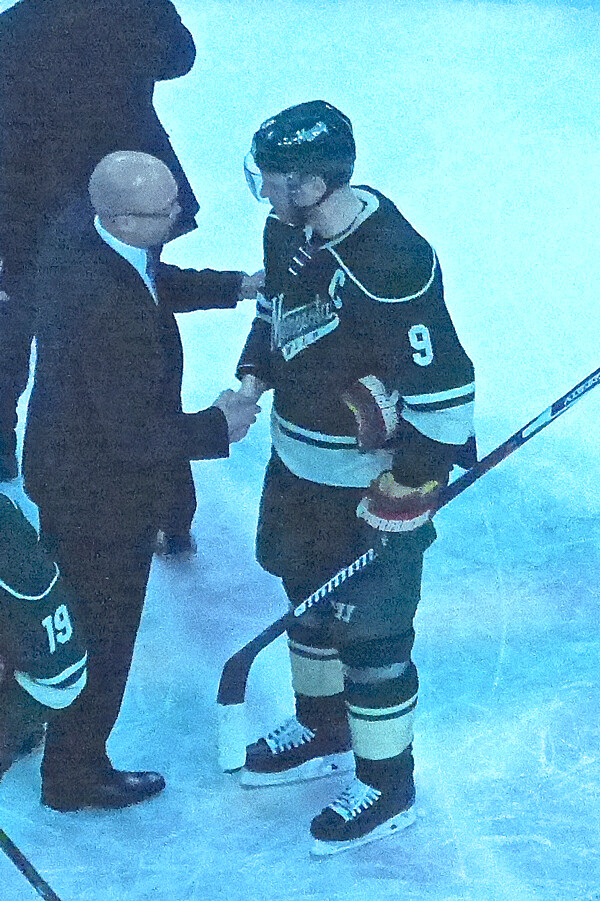St. Louis coach Mike Yeo exchanged post-game congratulations with Wild captain Mikko Koivu. Photo credit: John Gilbert