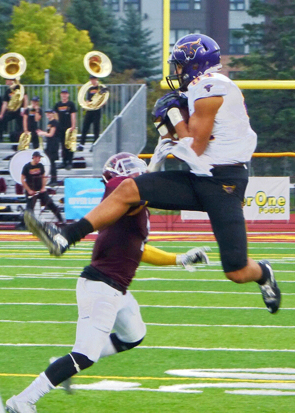 MSU-Mankato’s Shane Zylstra made a leaping grab for one of his 8 catches for 204 yards in the Mavericks 38-23 victory at UMD. Photo credit: John Gilbert