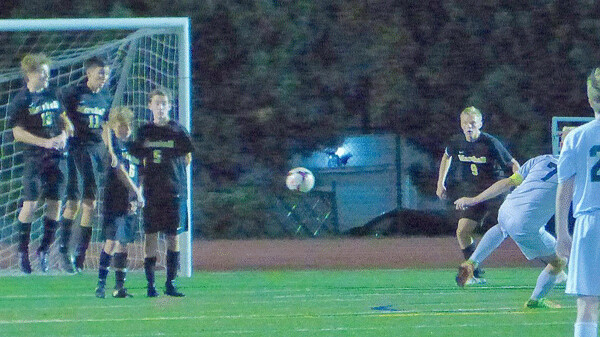 Chisago Lakes star Nils Gulbranson fired a free kick through a wall of Marshall blockers for his state-best 39th goal to clinch the state tournament berth 3-1. Photo credit: John Gilbert