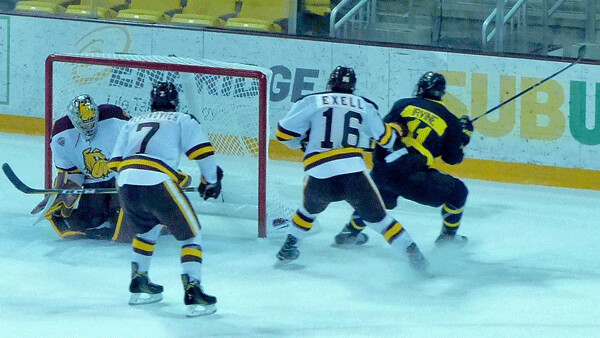 Merrimack's Tyler Irvine scored on UMD goalie Nick Deery at 4:02 of the second overtime Friday - a goal that officially didn't count. Photo credit: John Gilbert