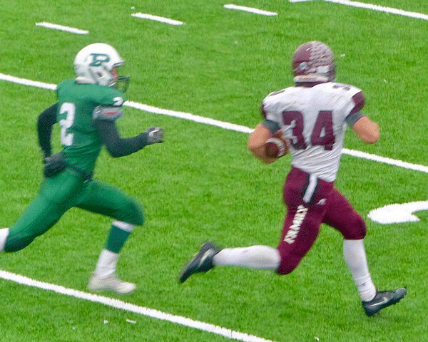 Two Harbors running back Spencer Ross finally broke away from Proctor’s defense for his 20th touchdown of the season, a 69-yard run to tie Proctor 10-10 in the fourth quarter of their 7AAA semifinal. Photo credit: John Gilbert