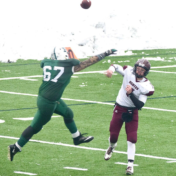 Two Harbors quarterback Ryan Darsow barely got this pass away over Proctor’s Adam McRae in the 7AAA semifinal at Proctor. Photo credit: John Gilbert