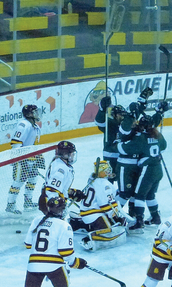 Bemidji State players engulfed Haley Mack's wraparound goal on her own rebound for a 2-2 tie in Saturday's game. Photo credit: John Gilbert