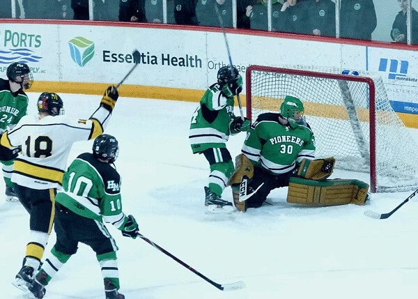Game-winning goals are the specialty of Marshall’s Peter Hansen (18), who fired a power-play goal past Hill-Murray goaltender Remington Keopple with 3:53 left Saturday in a 3-2 victory. Photo credit: John Gilbert