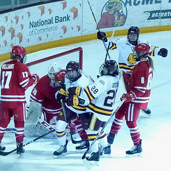 UMD sophomore Jalyn Elmes flashed a big smile after putting her own rebound past Wisconsin goalie Kristen Campbell for a 1-0 lead in an eventual 3-3 tie Satiurday. Photo credit: John Gilbert