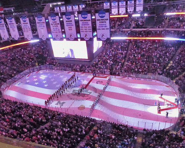 Before the NCAA final, Xcel Center ceremonies included a flag video that covered the rink.  Photo credit: John Gilbert