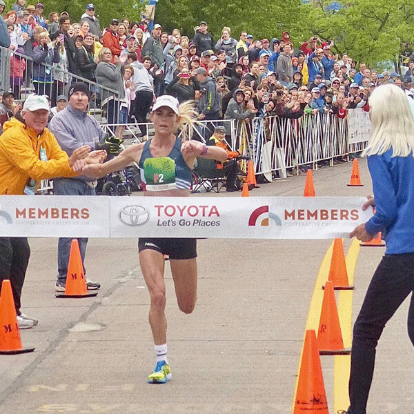 Kellyn Taylor, who started running in her native Sussex, Wis., ran her first Grandma’s and shattered the course record with a 2:24:29. Photo credit: John Gilbert