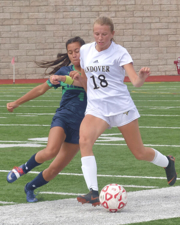 Andover’s Anna Breffle (18) protected the ball from Rosemount’s Camryn Rund-Chindakone during Andover’s 6-0 title victory. Photo credit: John Gilbert