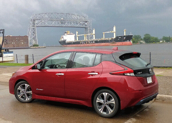 Nissan Leaf all-electric vehicle paused within view of Duluth’s Aerial Bridge. Photo credit: John Gilbert
