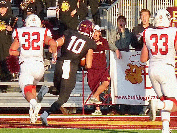 ..and it came down in the arms of Johnny McCormick (10) for a 32-yard touchdown and  a 21-0 lead. Photo credit: John Gilbert