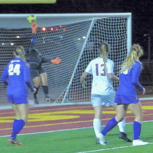 MSU-Mankato’s Brynn Designs, far right, watches as her shot barely  grazes the fingertips of UMD goalkeeper Sisley Ng... 