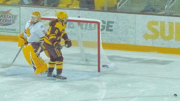 UMD goaltender Maddie Rooney stops Olympic roommate Kelly Pannek in Saturday's shootout, swiping the victory point from the Gophers. Photo credit: John Gilbert