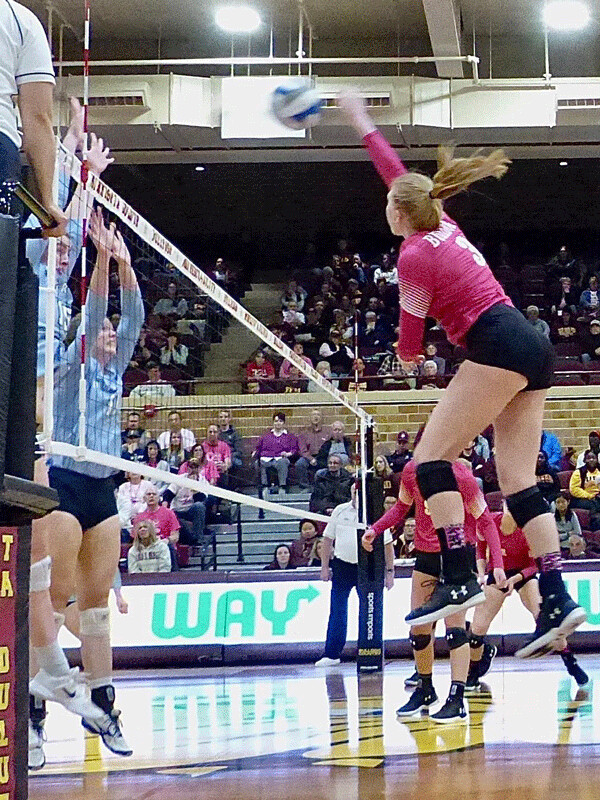 UMD sophomore  Kate Berg had 24 kills and 21 digs in last weekend's two matches, wearing pink breast cancer jerseys against Upper Iowa. Photo credit: John Gilbert