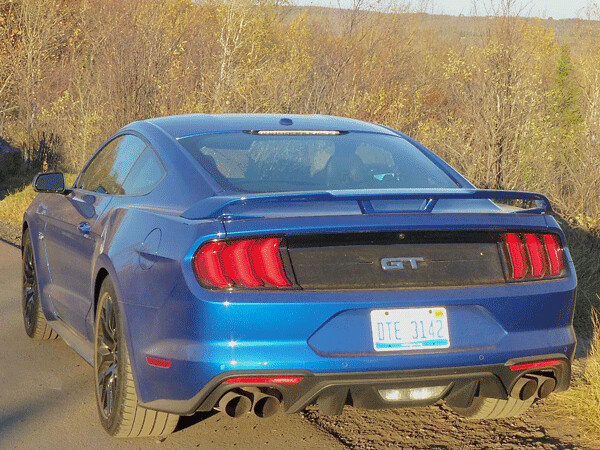Quad tailpipes, distinctively carved taillights set off Mustang rear. Photo credit: John Gilbert