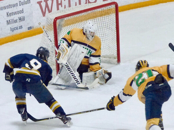 Brady Baker, who had one of the two Hermantown goals, was beaten by goalie Will Tollefson’s quick glove in the Hawks 3-2 loss. Photo credit: John Gilbert