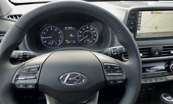 Intuitive controls on steering wheel surround businesslike instruments.  Photo credit: John Gilbert