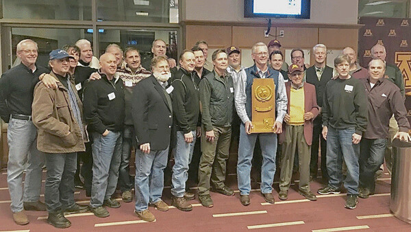 Billy Baker held the trophy as almost the entire 1978-79 Gopher NCAA championship team gathered for its 40th reunion Saturday. Photo credit: John Gilbert