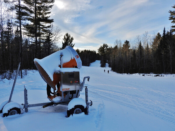 This snow gun helped create 3 kilometers of early season skiing, even while the rest of the Birkie trail took longer than usual to open. Snowmaking is just one piece of the sustainability puzzle, though. Photo by Emily Stone. 