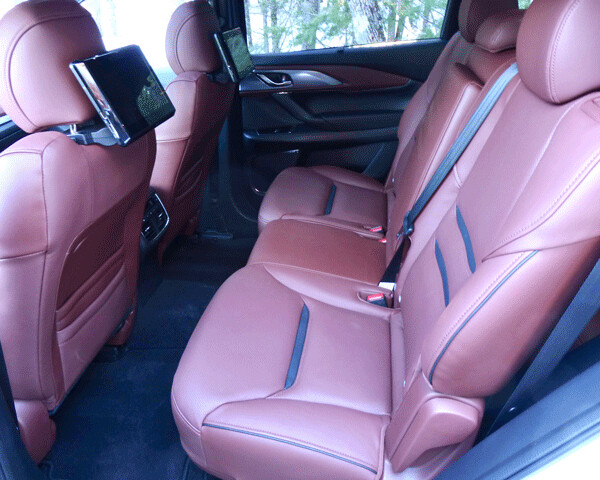 Rear seats are also spacious, and now have entertainment system with  individual monitors. Photo credit: John Gilbert