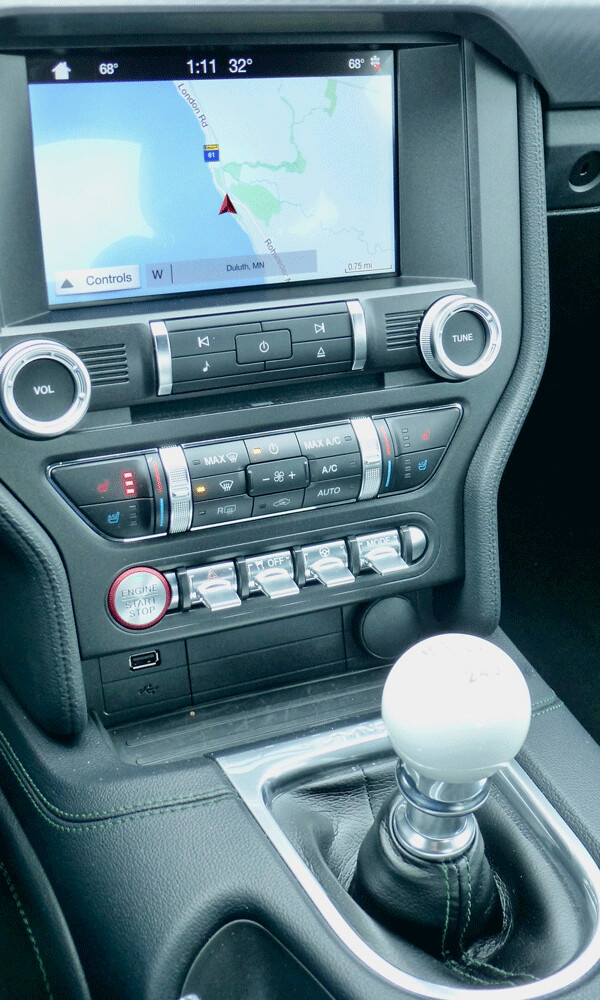 Giant shift ball and center console’s switchgear include toggles for various  features. Photo credit: John Gilbert