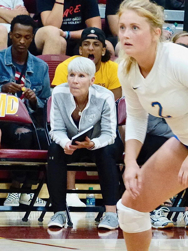 Dana Moore, who is going into her 23rd season as St. Scholastica volleyball coach, paid close attention to her team's competitiveness. Photo credit: John Gilbert