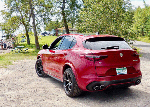 Stelvio comes with AWD and sporty luxury inside for front and rear occupants, and  quad exhausts speak in exhilarating tones. Photo credit: John Gilbert