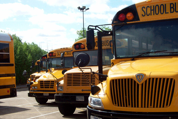 Research shows that replacing or retrofitting dirty old diesel school buses can reduce the pollution inhaled by students significantly and can even lead to better health and higher standardized test scores. Credit: madame.furie, FlickrCC.