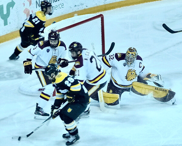 Hunter Shepard had to work for his 5-0 shutout, surviving a scramble against Colorado College in the second period. Photo credit: John Gilbert