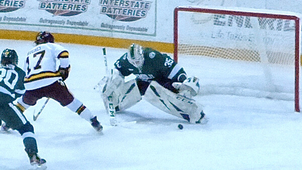 Bemidji State goalie Lauren Bench deflected Anna Klein's shot up an's 4-2 victory for a UMD sweep of the series at AMSOIL Arena. Photo credit: John Gilbert