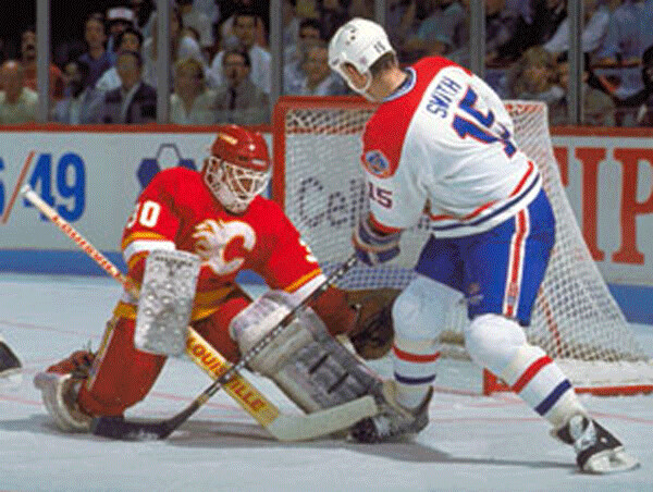Former NorthStar Bobby Smith goes  against Mike Vernon in the 1989 Stanley Cup Final