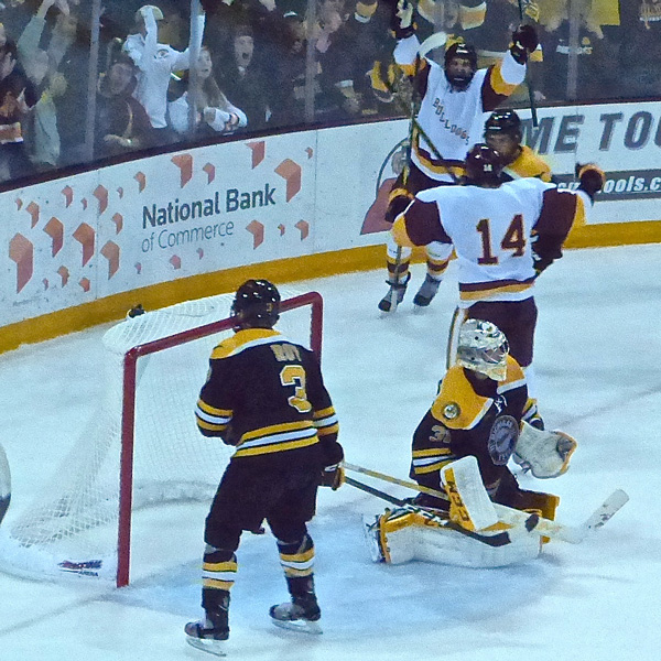 Alex Iafallo (14) sped past the Michigan Tech goal after his high-speed deflection goal gave UMD a 4-3 victory at 19:45. Photo credit: John Gilbert