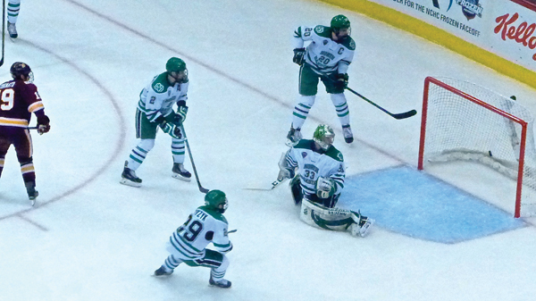 Dominic Toninato (extreme left) clinched the 4-2 victory over North Dakota with his second goal of the game. Photo credit: John Gilbert