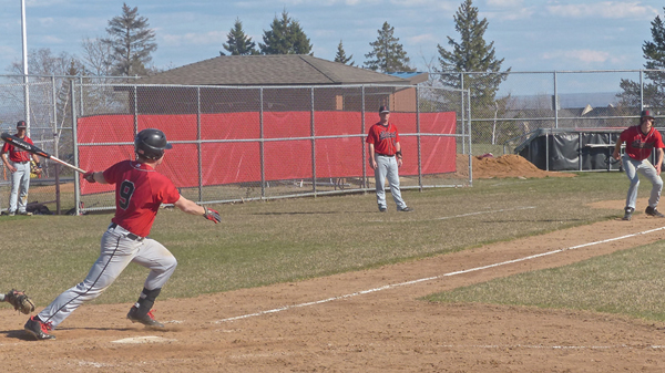 East’s Nathaniel Benson hit the ball to drive in the tie-breaking run against Hibbing. Photo credit: John Gilbert