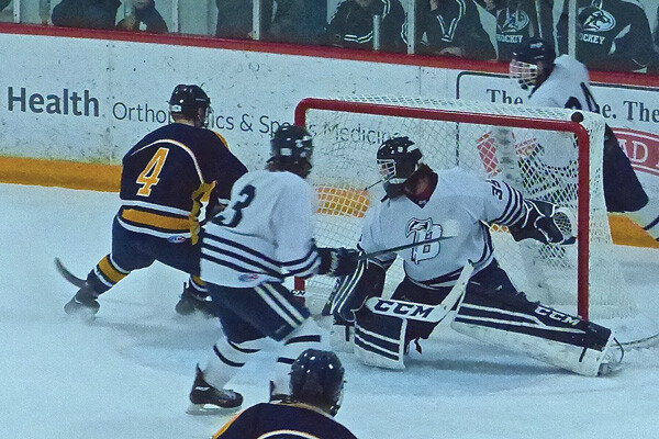 Hockey takes over where Vikings have faltered:&nbsp;Hermantown&rsquo;s Matt Valure (4) cut past the net after failing to score early in the Hawks&rsquo; opening 4-0 Hilltopper Classic tournament game against Bemidji. Final in the tournament will be Thursday afternoon. Photo credit: John Gilbert