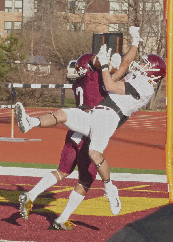 Senior Nate Ricci started the annual Spring Game where he left off for UMD last year, leaping to catch a pass from John Larson for a 20-yard touchdown, despite Mitchell Johnson-Martin's aggressive defense. Photo credit: John Gilbert