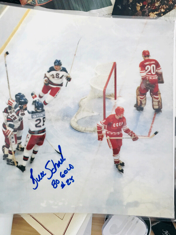 Babbitt's Buzzy Schneider (25) was congratulated by teammates after scoring against Vladislav Tretiak to tie the USSR 1-1 in the first period, 40 years ago, at Lake Placid. Buzzy liked my photo so much he signed it! Photo credit: John Gilbert