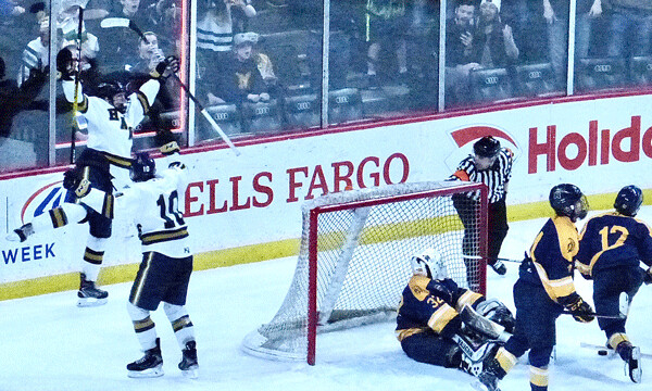 In the title game, Aaron Pionk celebrated after tying Mahtomedi 2-2 with 21.2 seconds remaining. Photo credit: John Gilbert