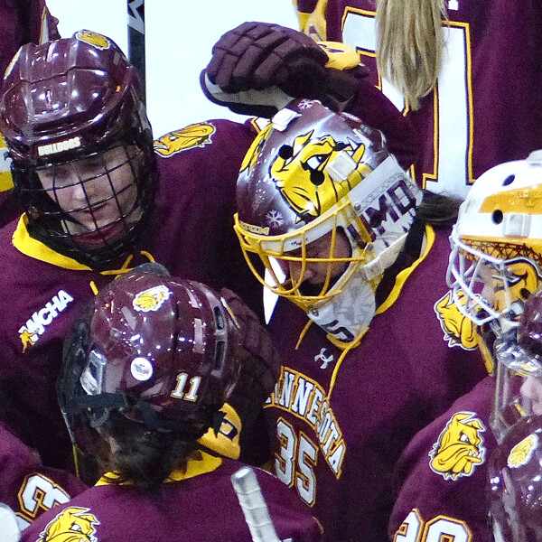 Bulldog teammates surrounded Maddie Rooney after her last collegiate game in goal had ended with a 4-1 defeat. Photo credit: John Gilbert