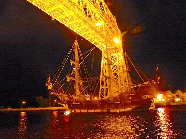 El Galeon, the Spanish galleon that stayed in Duluth after the other Tall Ships departed, drew only a spontaneous crowd of appreciative onlookers as it left under the Aerial Bridge about an hour after sunset last Wednesday night. – Photos by John Gilbert.